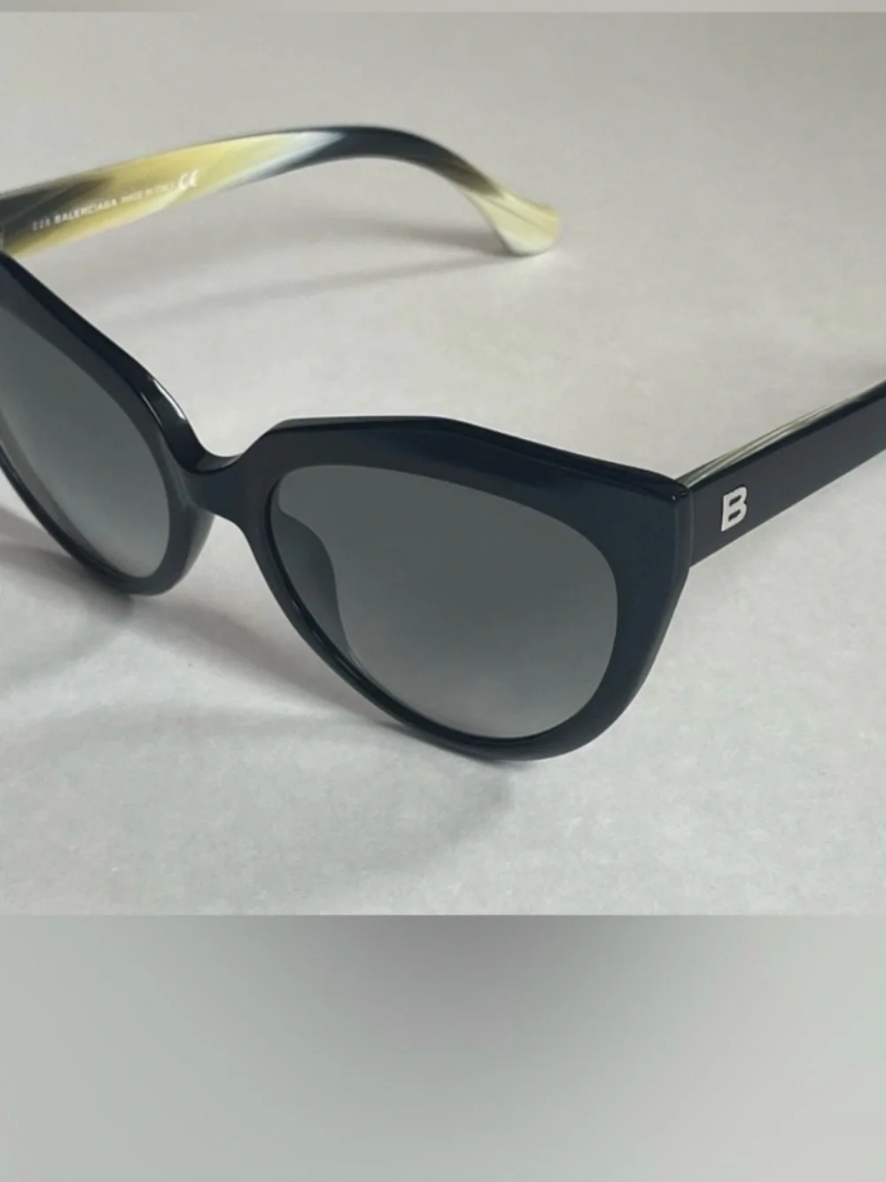 Balenciaga Black Cat-Eye Sunglasses with Brown Gradient Lenses.